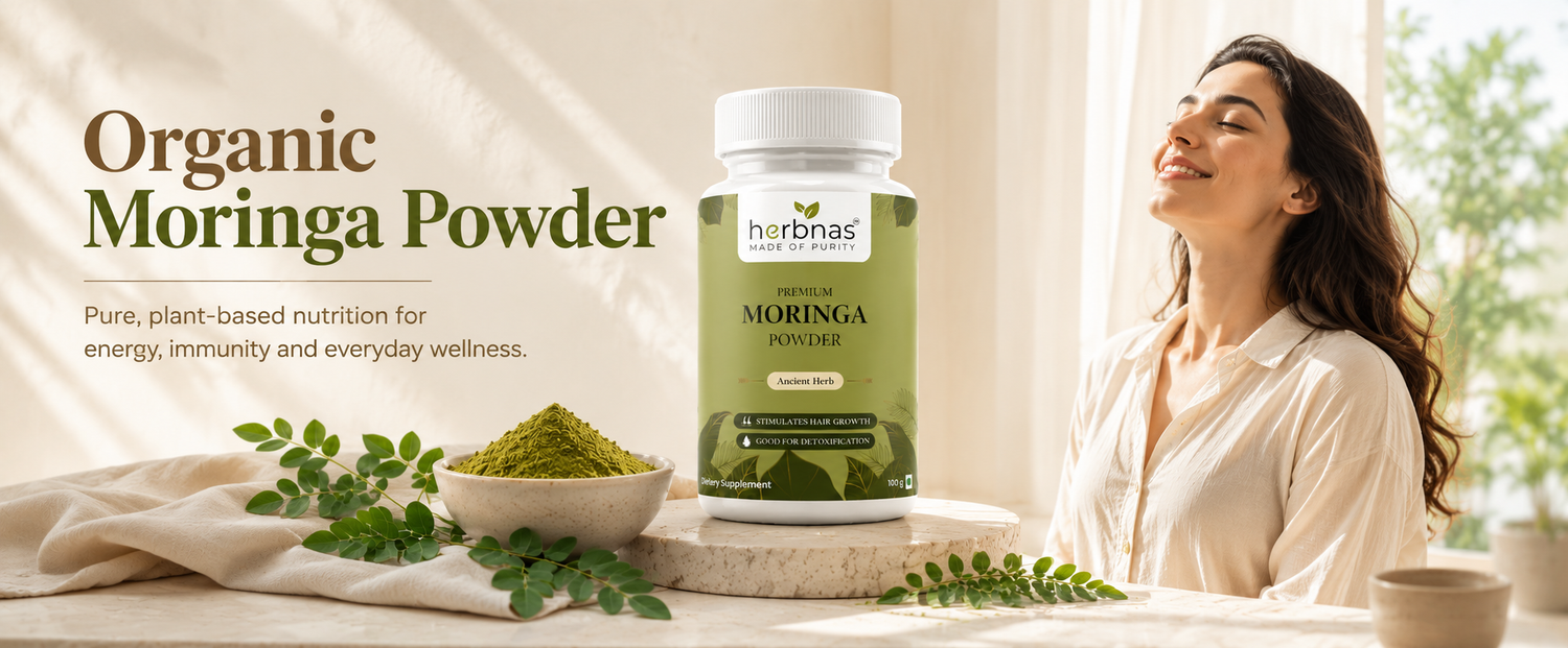 A bottle of Harbina Organic Moringa Powder supplement is displayed on a table next to a bowl of green powder and fresh leaves, with a woman smiling in a bright room in the background.